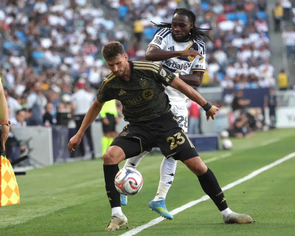 LAFC defender Yevhen Cheberko boxes out Galaxy forward Joseph Paintsil...