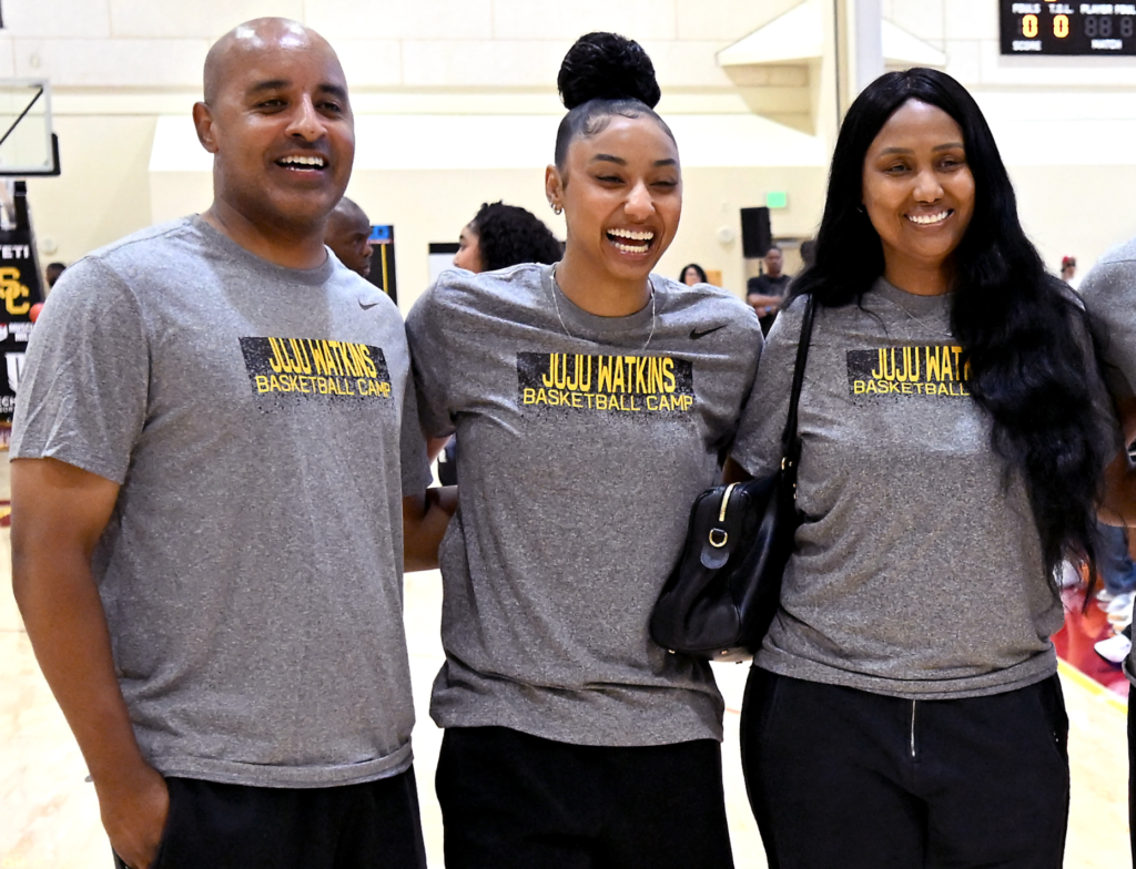 JuJu Watkins stands with her parents Robert Neal-Watkins and Sari...