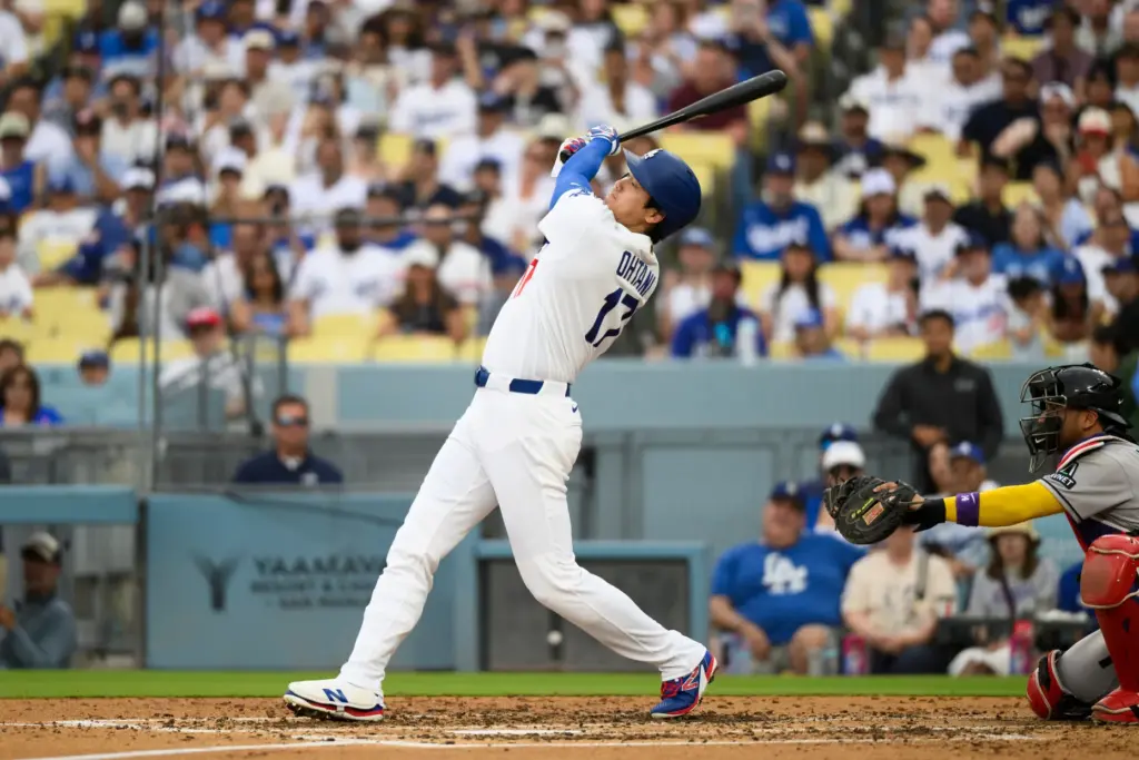 Dodgers’ Shohei Ohtani watches his double during the third inning...
