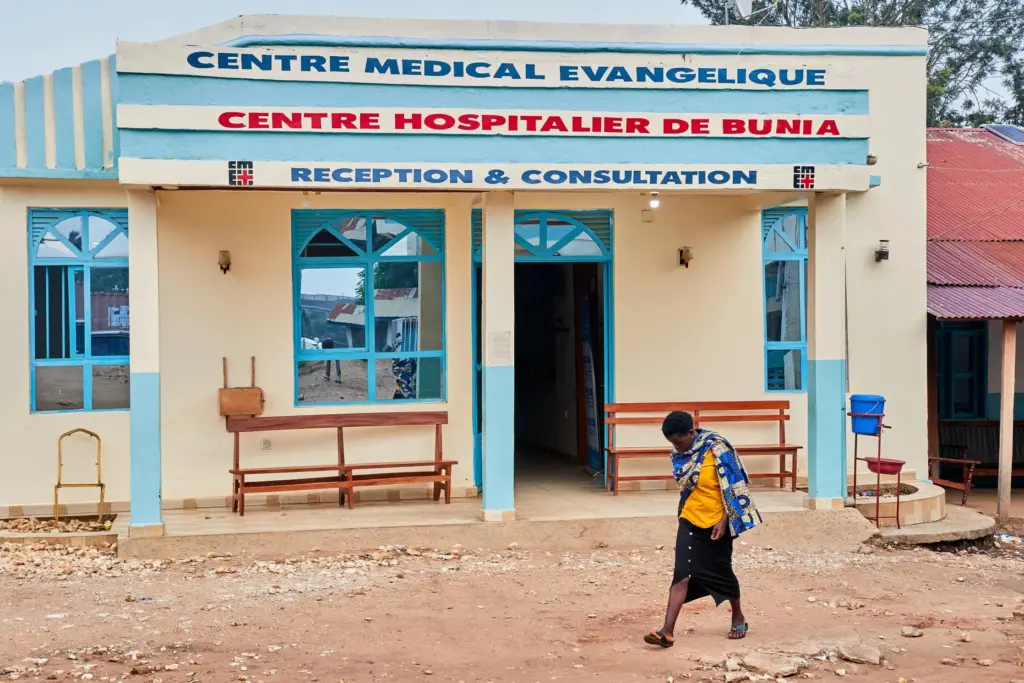 A woman walk past the Evangelical Medical Center, in Bunia, eastern Congo.