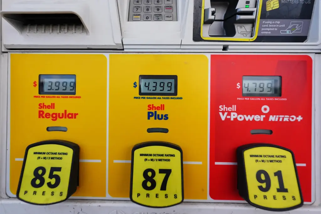 The per-gallon prices are illuminated electronically above the three grades...
