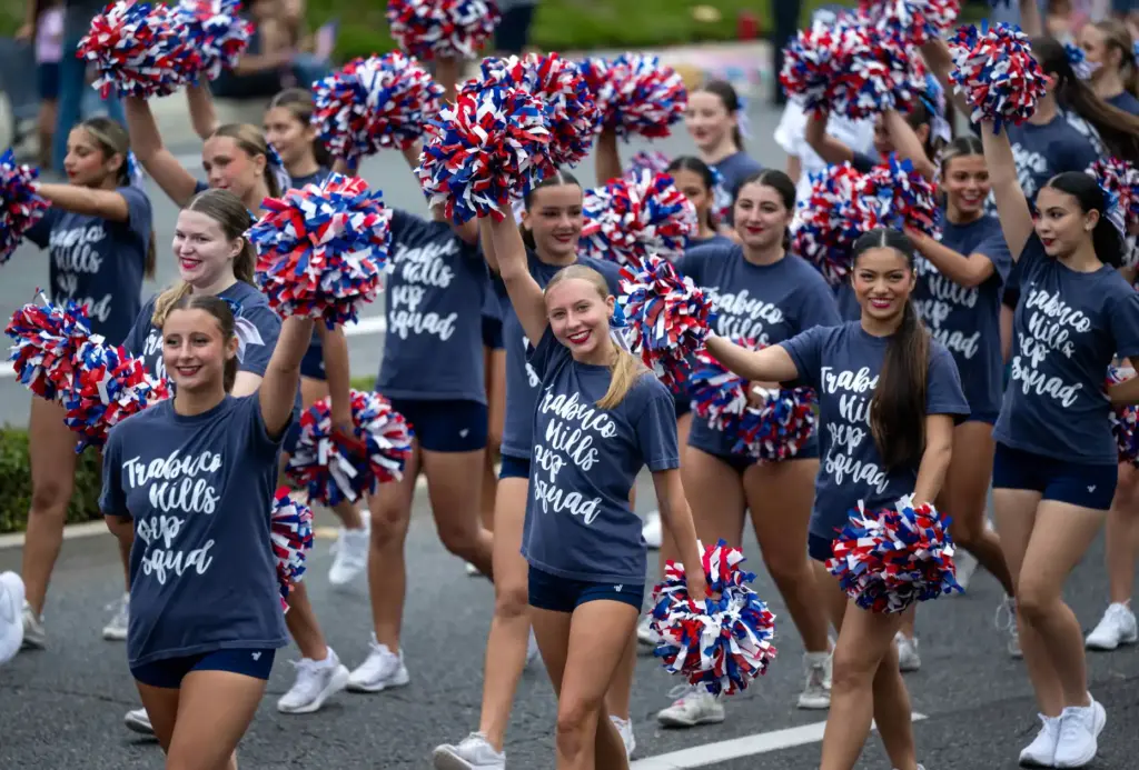 Trabuco Hills High School pep squad members perform as they...