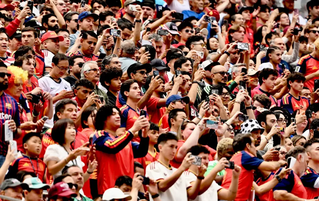Spain and Austrian fans watch as their team enters the...