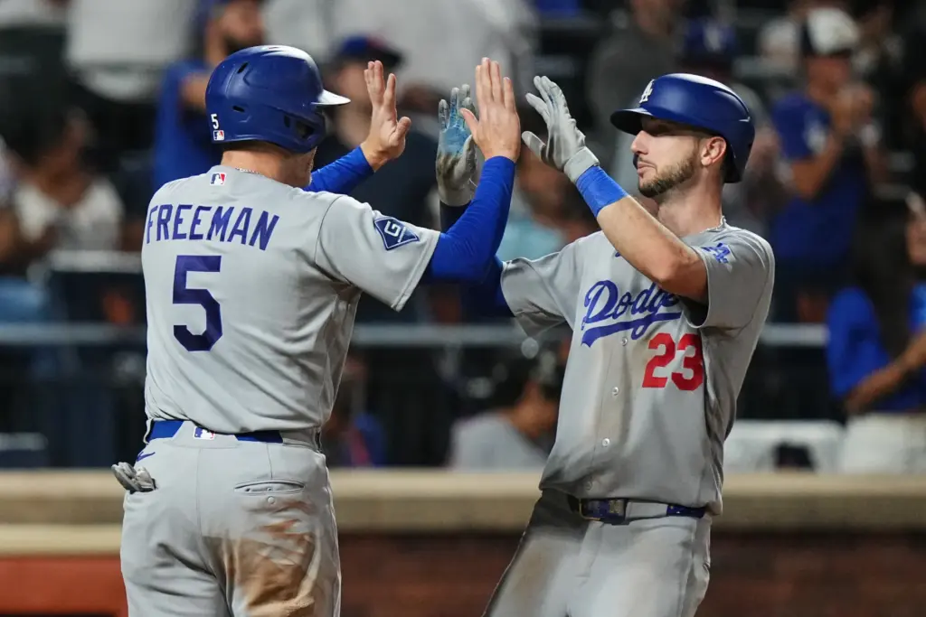 Dodgers’ Kyle Tucker (23) celebrates with Freddie Freeman (5) after...