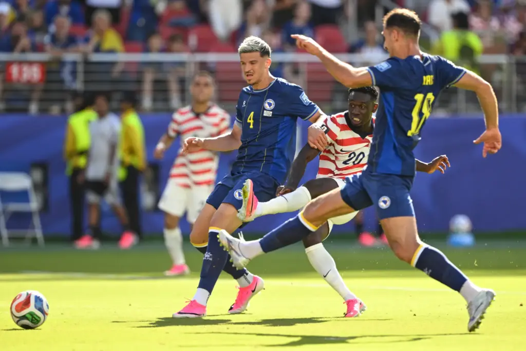 The United States’ Folarin Balogun (20) scores the opening goal...