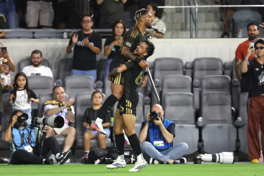 Los Angeles FC forward Denis Bouanga (99) is lifted by...