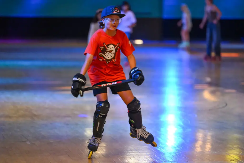 Hockey player Carter Patterson, 11, works out on rollerblades at...