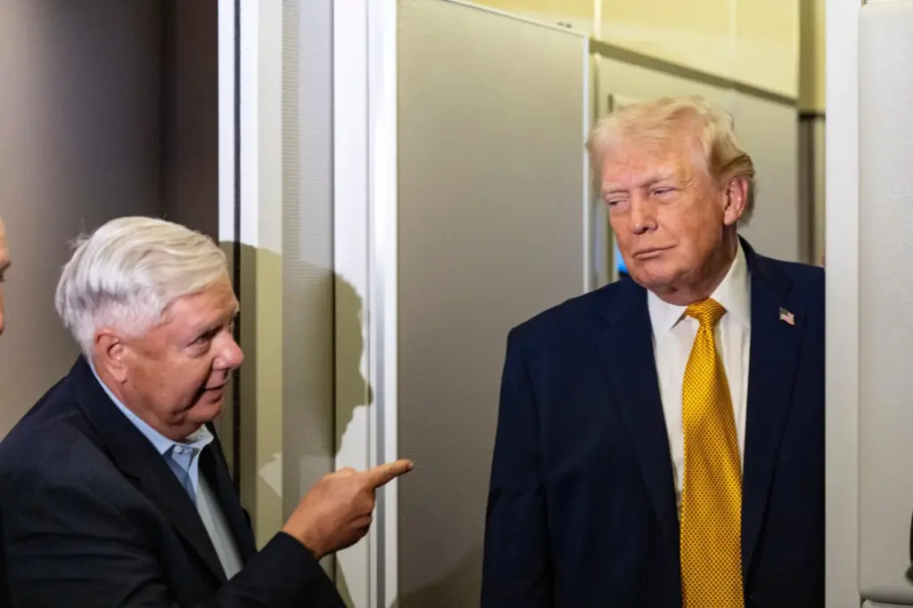 FILE – Sen. Lindsey Graham, R-S.C., left, gestures as President...