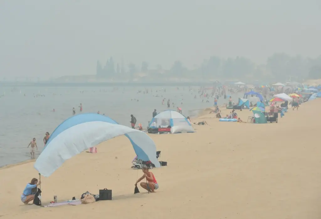 Hazy skies from Canadian wildfires cover Silver Beach and Lake Michigan.