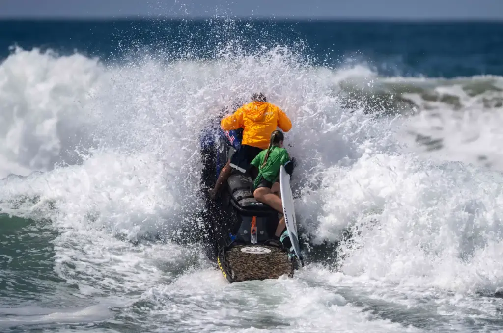 Australian surfer Ziggy Mackenzie rides on a wave runner as...