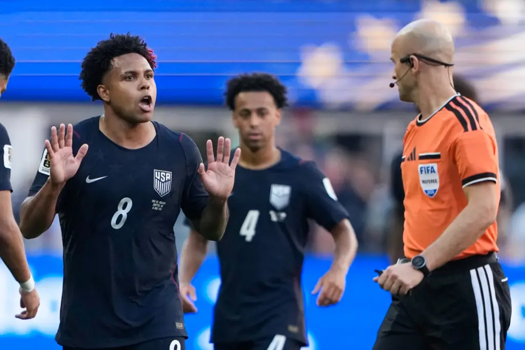 United States’ Weston McKennie (8) reacts after receiving. Yellow card...