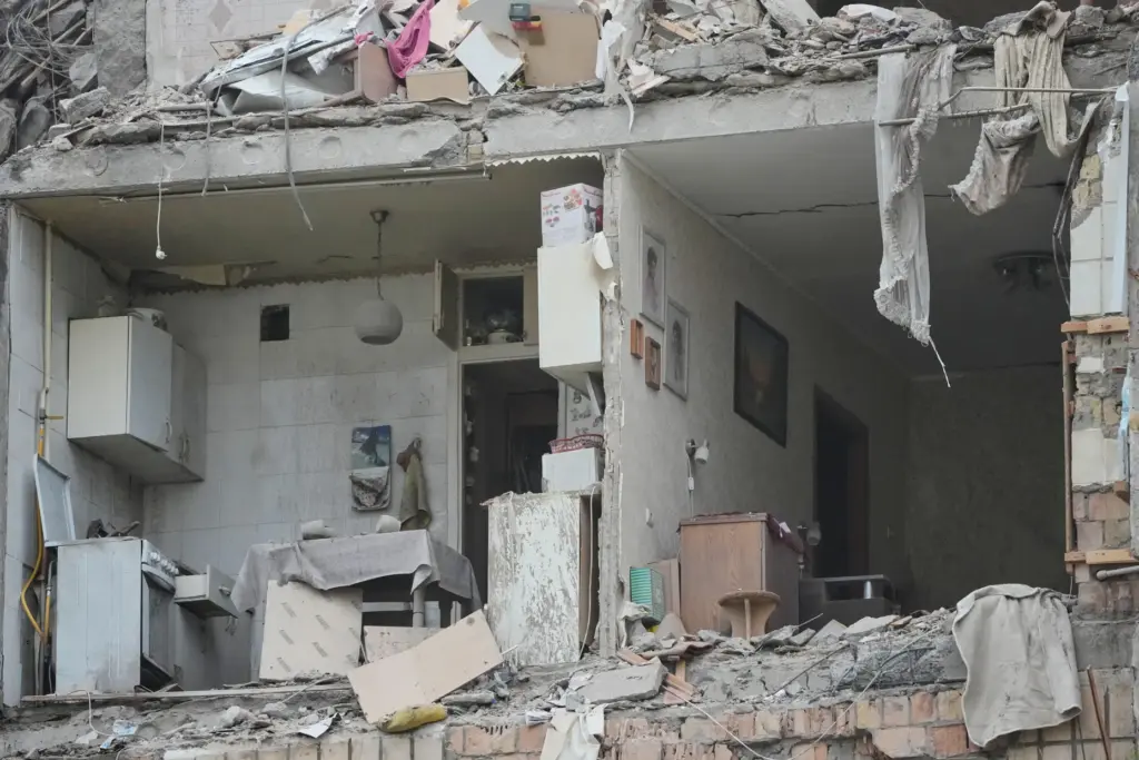 The damaged apartment interior in the ruined apartment building following Russia's missile attack in Kyiv.