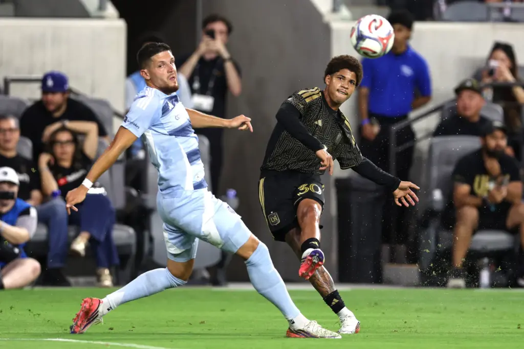 Los Angeles FC forward David MartÃ­nez, right, kicks the ball...