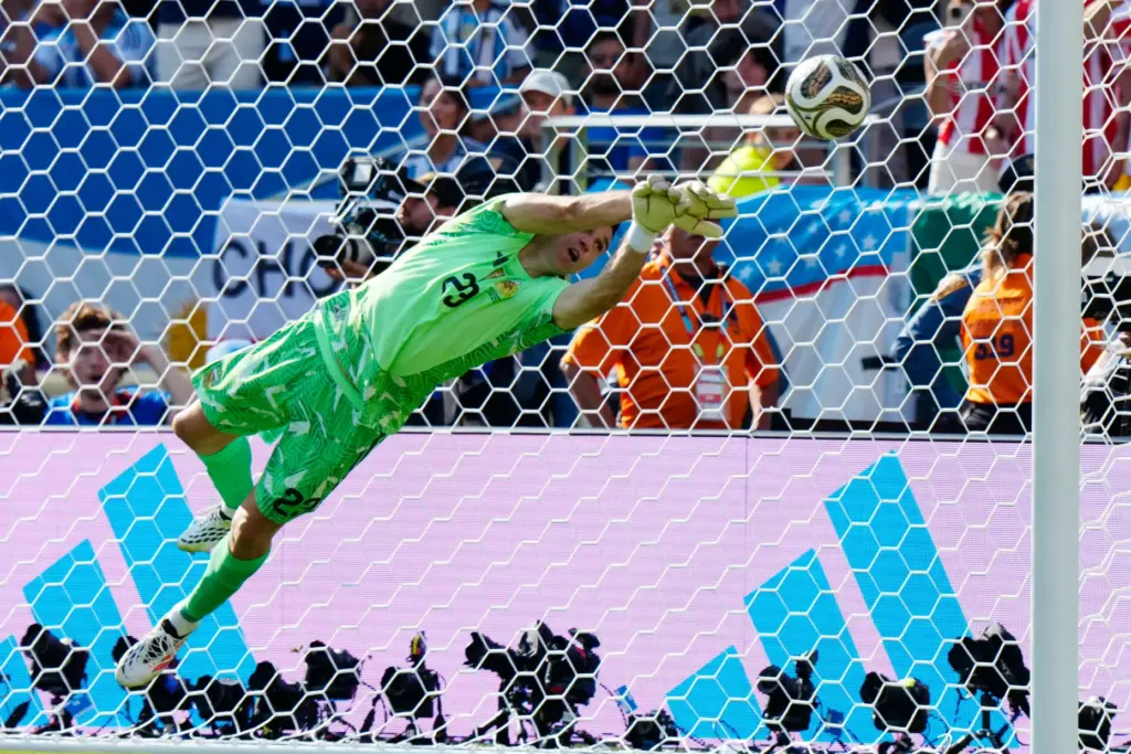 Argentina goalkeeper Emiliano MartÃ­nez makes a save against Spain during...