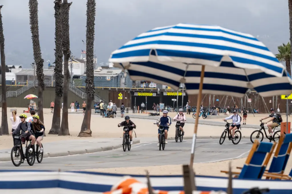 Beachgoers enjoy mild temperatures near the Santa Monica Pier on...