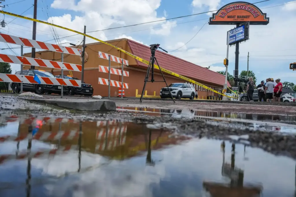 Police work on Canal Street in Houston, Tuesday, July 7,...