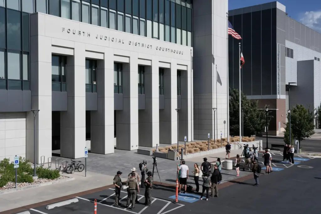 People stand outside the Fourth District Courthouse, Tuesday, July 7,...