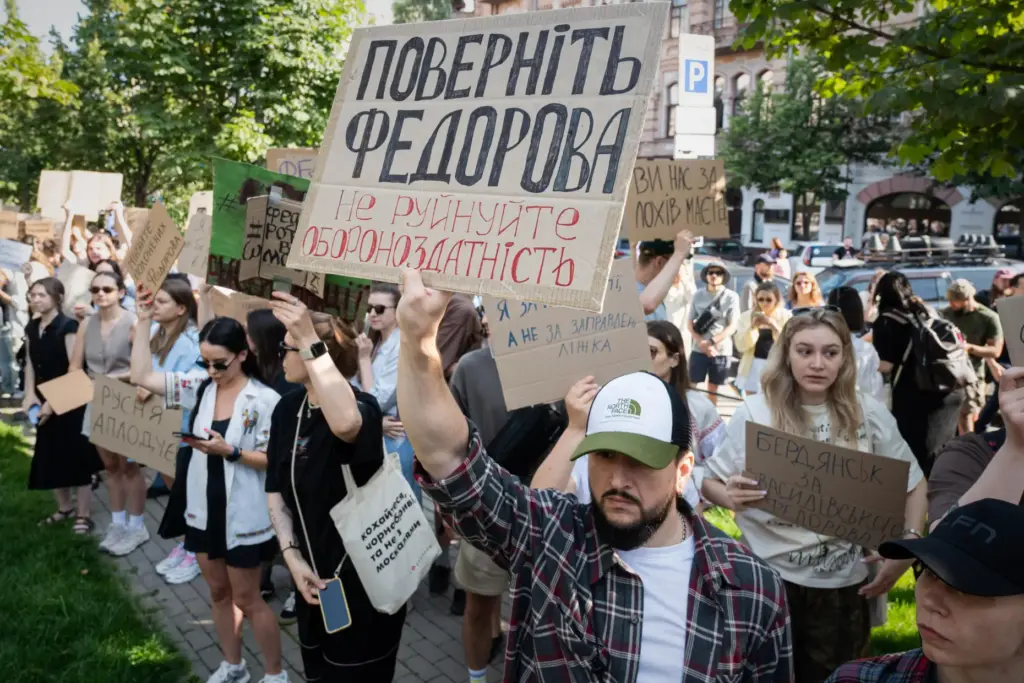 Ukranians gather to denounce President Volodymyr Zelenskyy’s decision to dismiss...