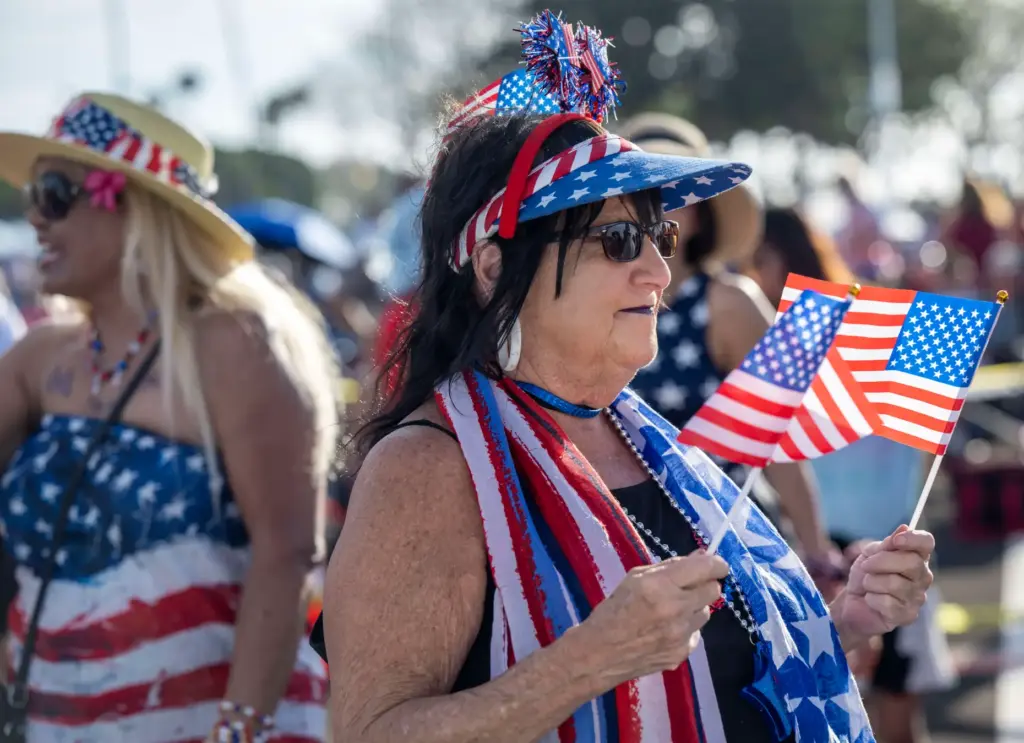 Mona Greenspan of Oceanside dances with a pair of American...