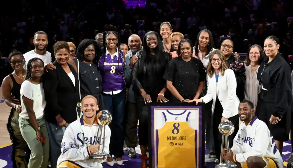 Former Sparks star DeLisha Milton-Jones, center, poses for a photo...
