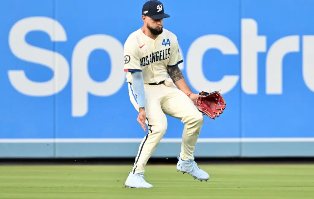 Centerfielder Andy Pages of the Dodgers fields a single by...