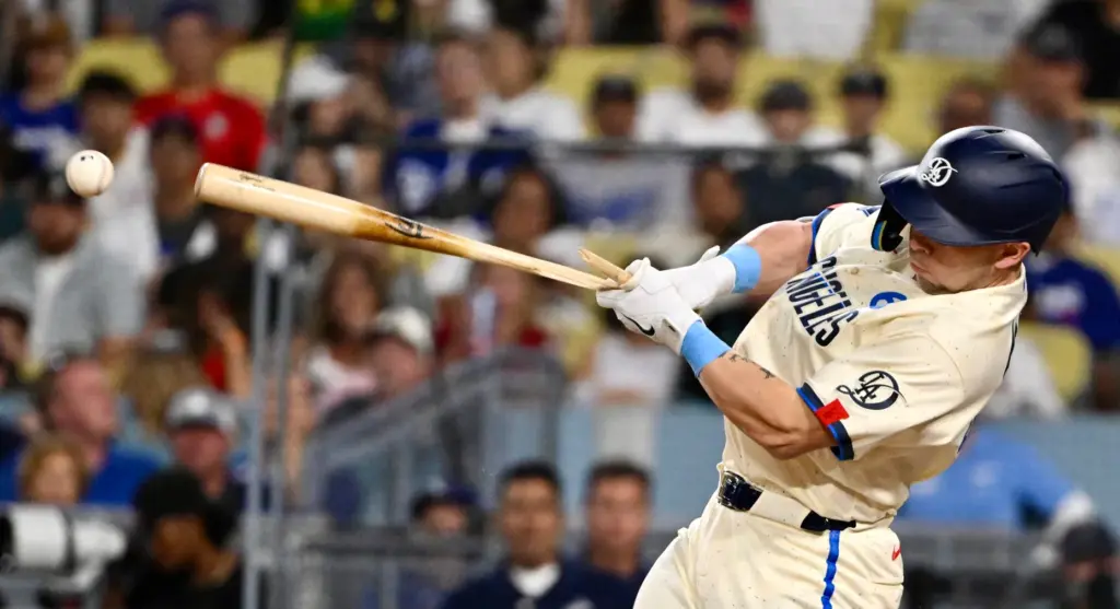 Daulton Rushing of the Dodgers lines out and breaks his...