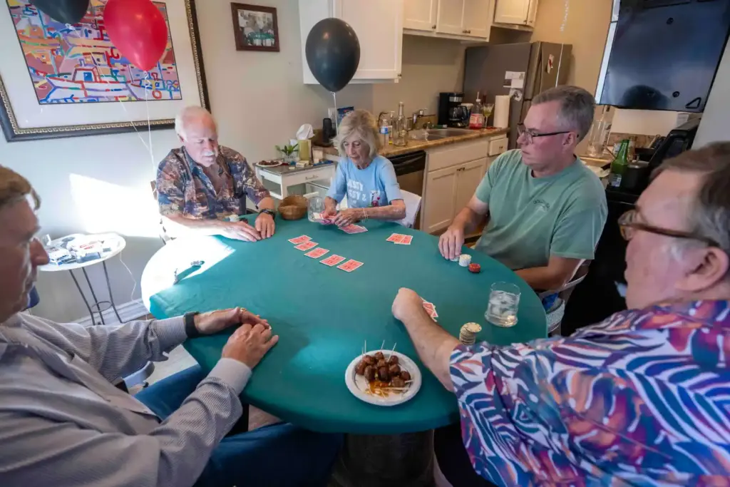Dorothy Dahms, center, 97, who has been hosting a weekly...