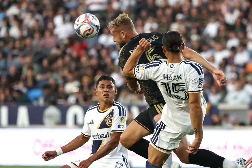 LAFC forward Ryan Porteous (5) heads the ball during the...