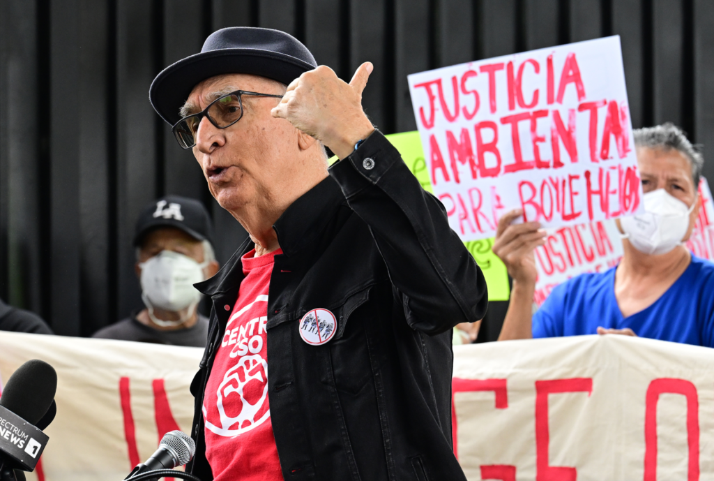 Carlos Montes speaks as residents and community organizations held a...
