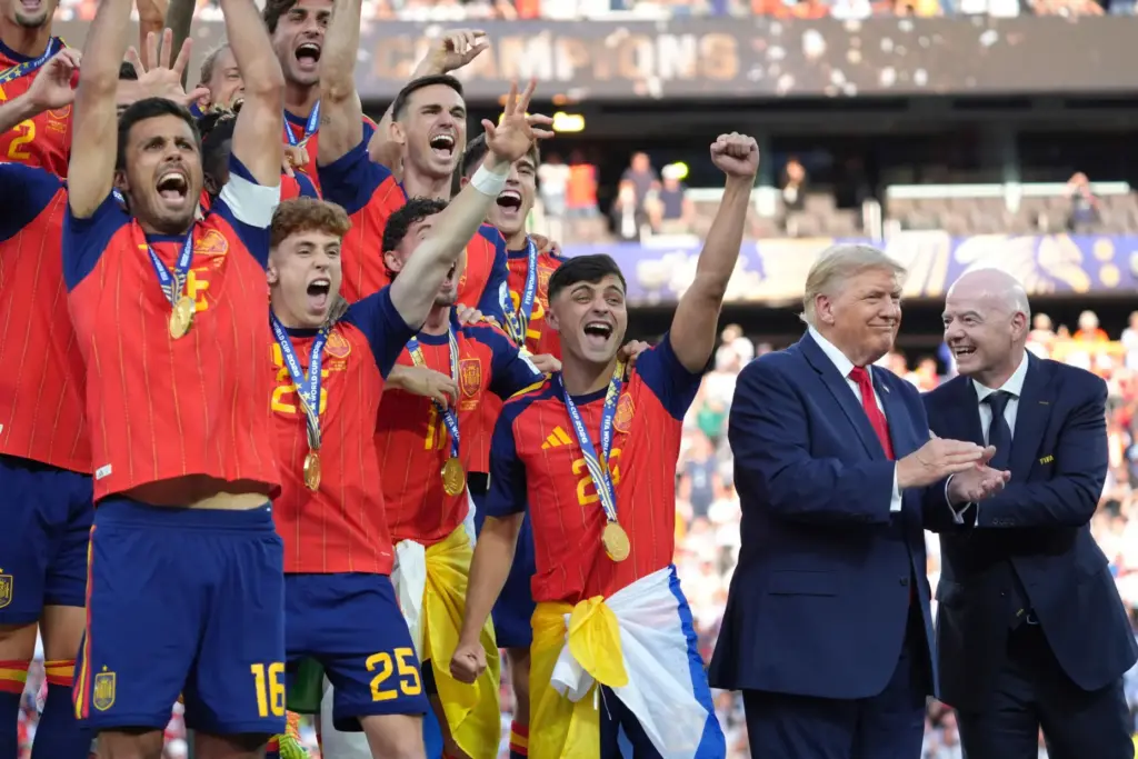 Spain players, from left, cheer alongside President Donald Trump and...