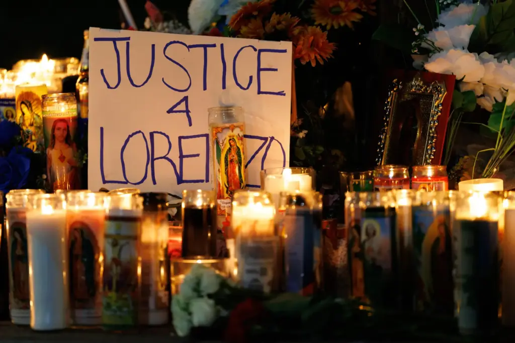 Candles are lit during a vigil for Lorenzo Salgado Araujo,...
