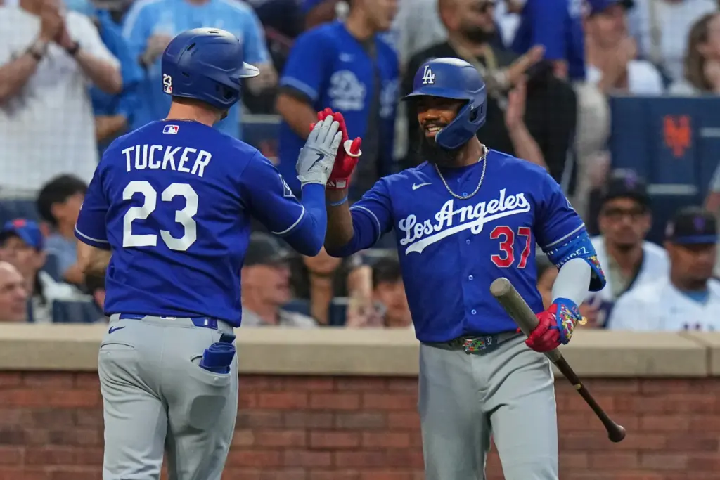 Dodgers’ Teoscar HernÃ¡ndez (37) celebrates with teammate Kyle Tucker (23)...