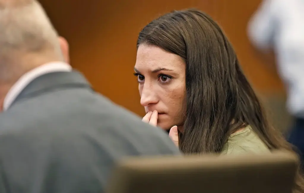Clancy confers with her lawyer Kevin Reddington during her murder...