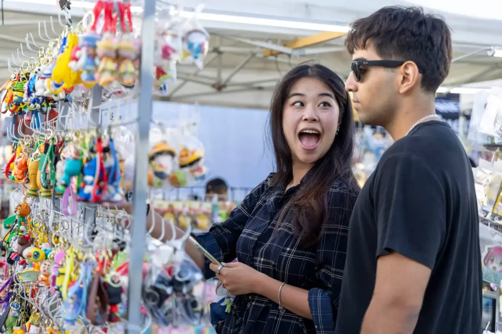 Amy Wang (left) smiles at her boyfriend, Amrit Sandhu, because...