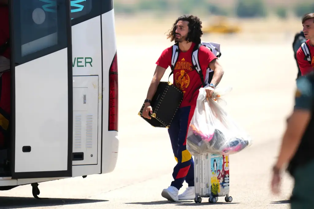 Spain’s Marc Cucurella arrives with the rest of his team...