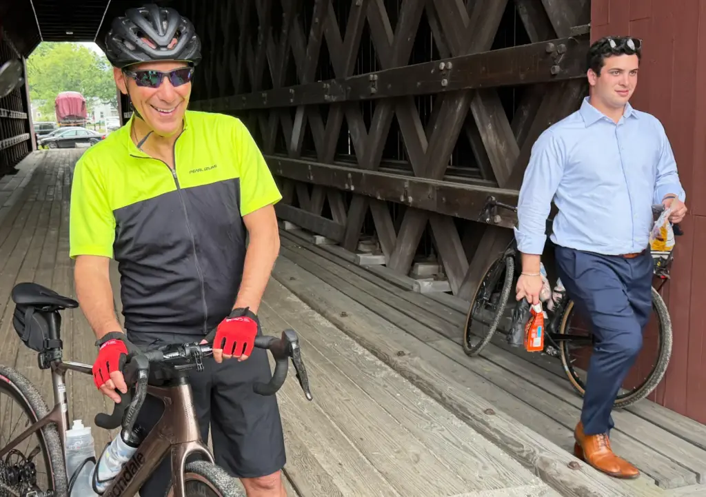 Rahm Emanuel takes a break from a bike ride through New Hampshire.