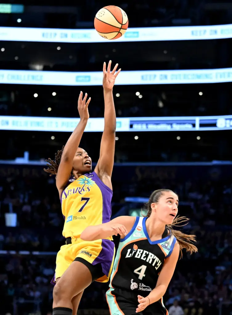 Sparks guard Ariel Atkins takes a shot over New York...