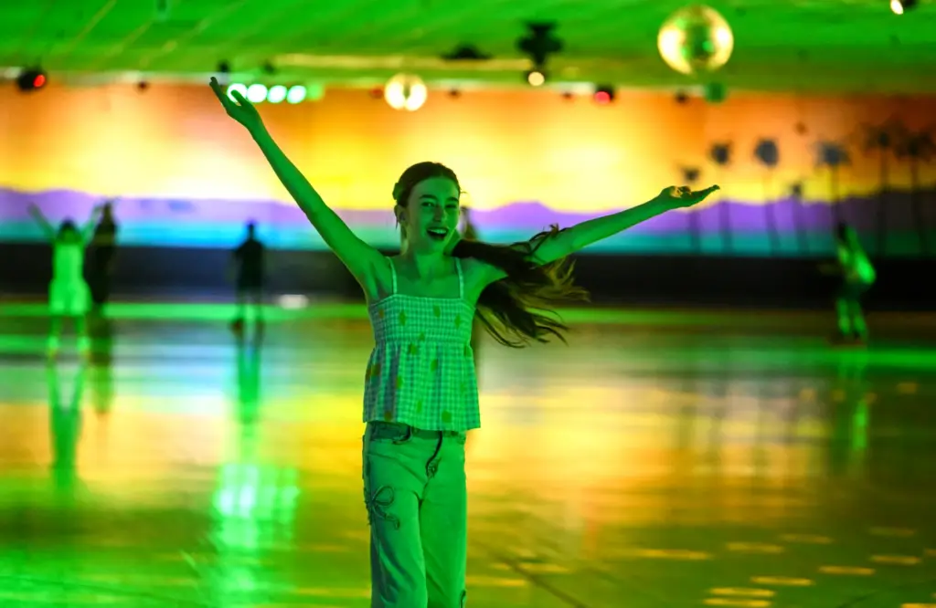 Nyla Smith, 12, dances to YMCA as she skates around...