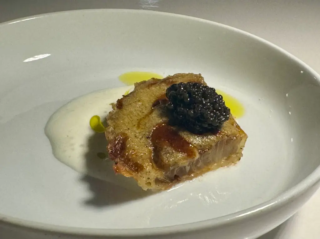 Onion tart slice with caviar at Chrysalis. (Photo by Brock...