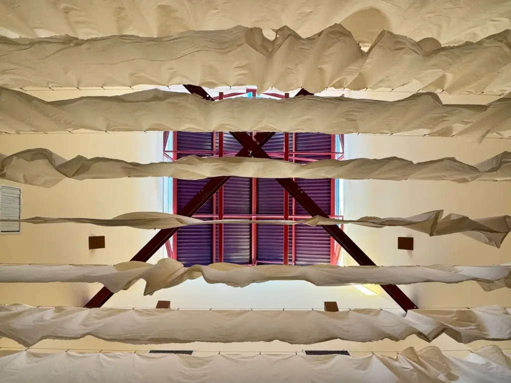 Look up: a fabric canopy softens the exposed steel trusses...