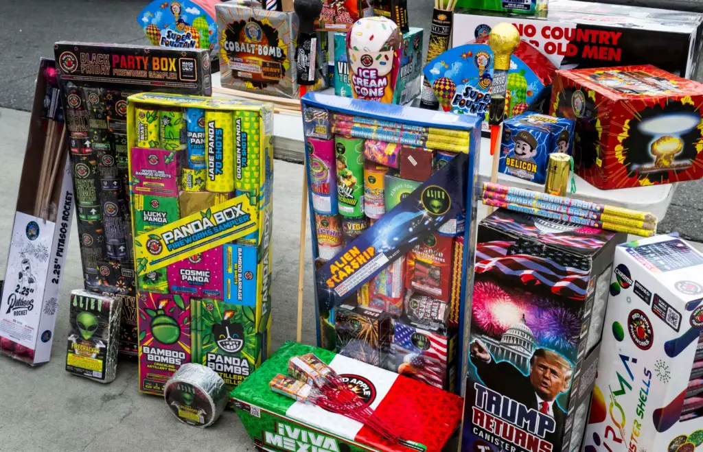Officials display illegal fireworks during a press conference at the...