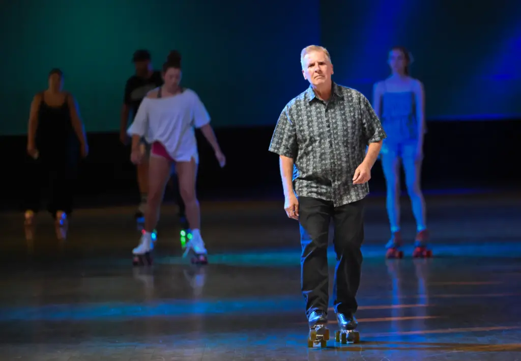 Donald Telford, owner of Holiday Skate Center, cruises around the...