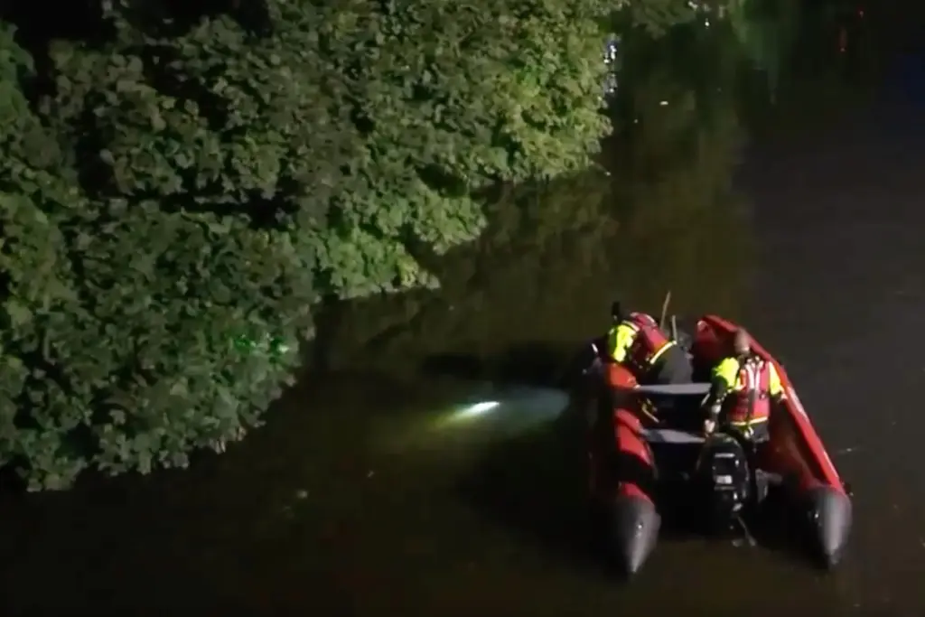 First responders search for missing children in the Passaic River.