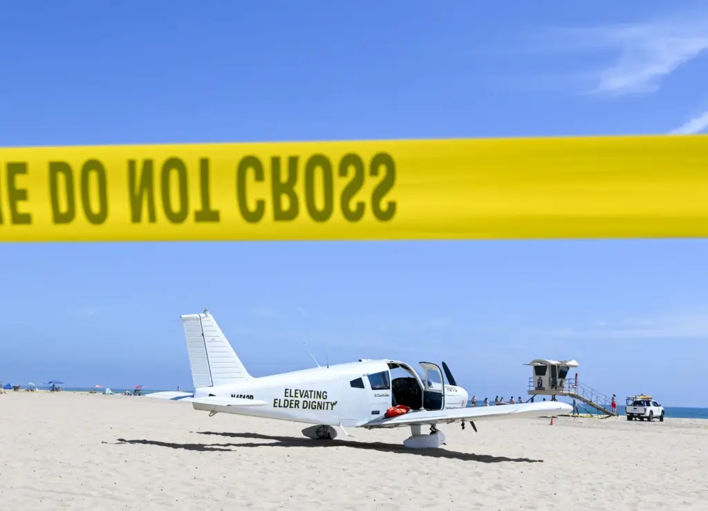 A Piper Cherokee 140 sits on the sand after an...