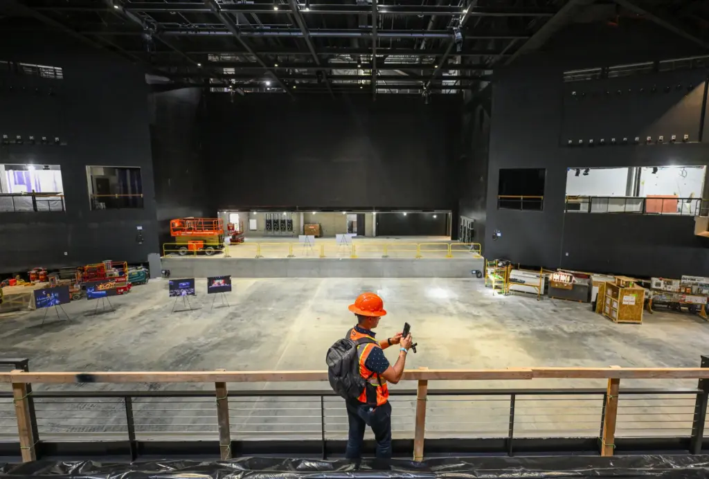 Visitors tour construction at the new concert hall at OC...