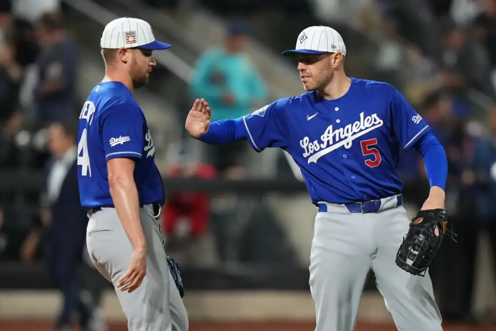 Dodgers’ Freddie Freeman (5) celebrates with pitcher Brock Stewart after...