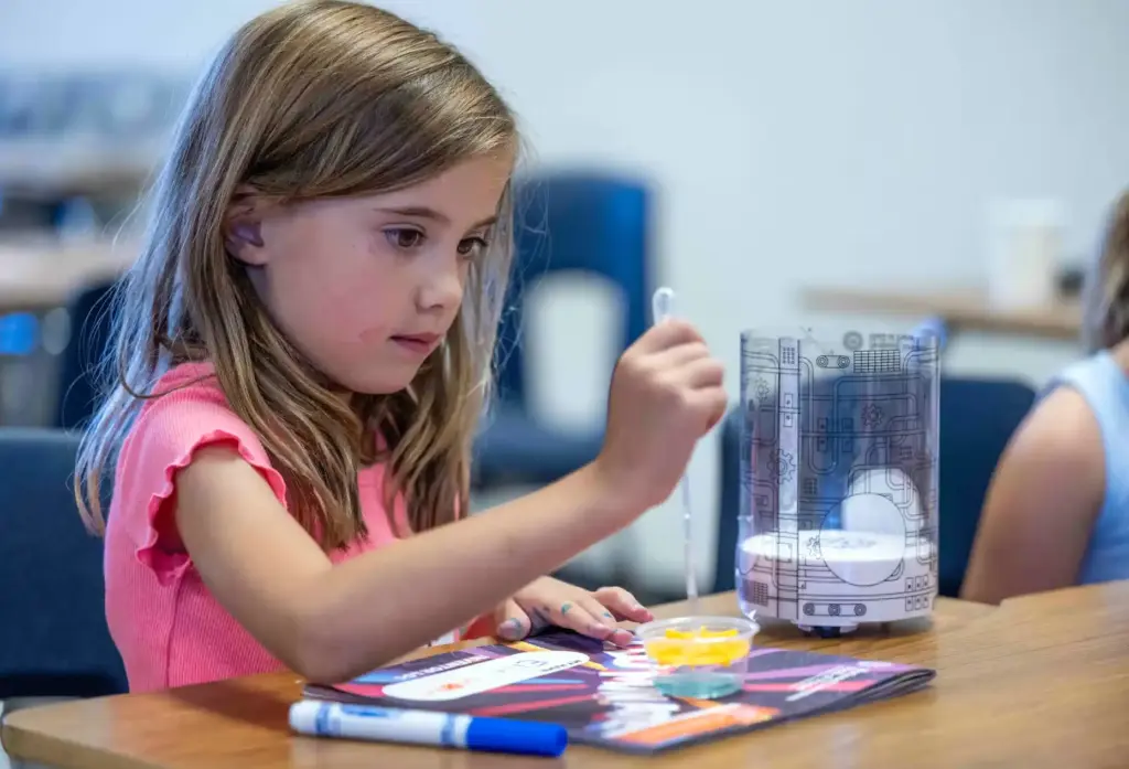 Ellie Schaeffer, 5, of Ladera Ranch uses a pipette to...
