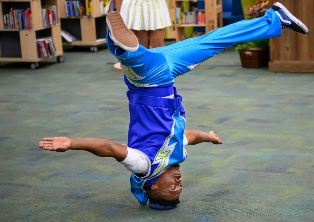 Secky Muya of the Ringling Bros Hype Crew does a...