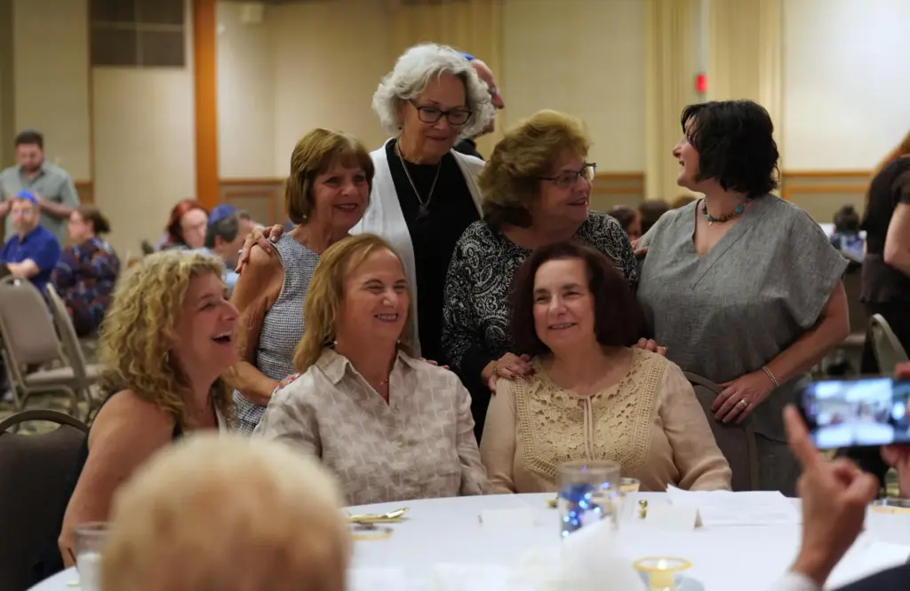 Friends, family and community members gather for the retirement dinner...