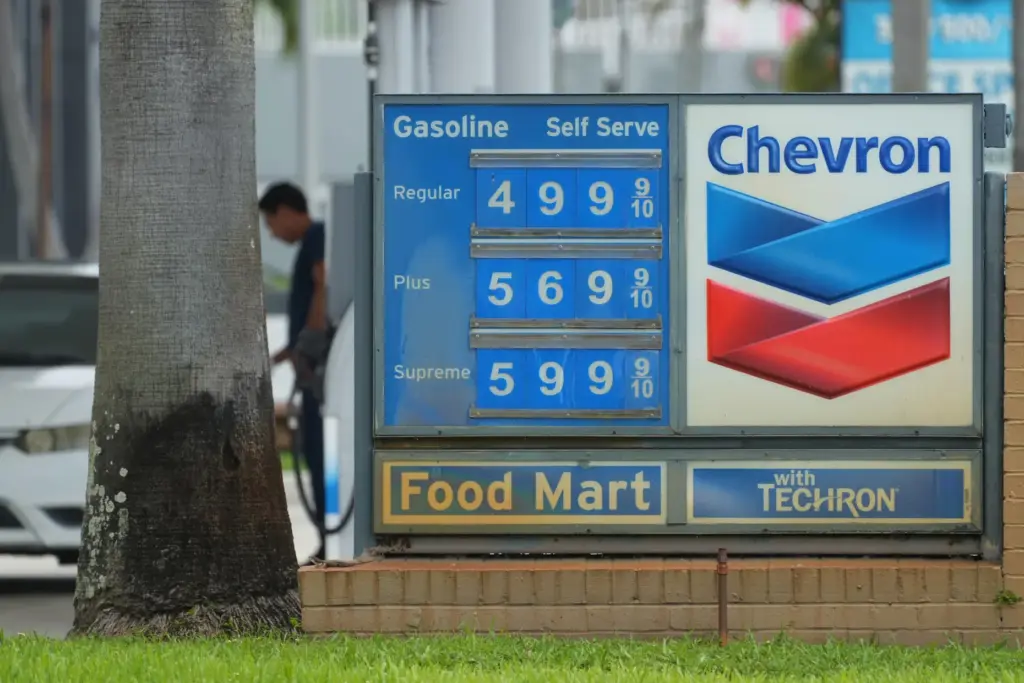 A customer pumps gas at a Chevron station.